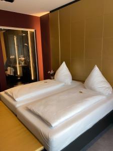 Postel nebo postele na pokoji v ubytování Primetime Hotel