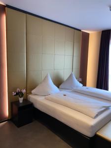 Postel nebo postele na pokoji v ubytování Primetime Hotel