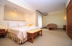 Postel nebo postele na pokoji v ubytování The Sultan Hotel & Residence Jakarta