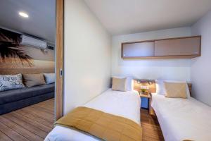 Postel nebo postele na pokoji v ubytování Porton Mobile Home