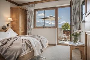 A bed or beds in a room at Aparthotel Stacherhof