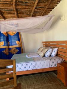 Ένα ή περισσότερα κρεβάτια σε δωμάτιο στο Nanano Beach Home Stay