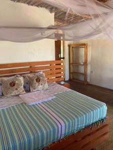 Postel nebo postele na pokoji v ubytování Nanano Beach Home Stay