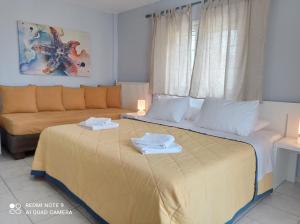 Ένα ή περισσότερα κρεβάτια σε δωμάτιο στο Sivotahomes-blu