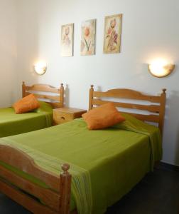 מיטה או מיטות בחדר ב-Turiquintas