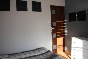 Posteľ alebo postele v izbe v ubytovaní Dom nad Morzem