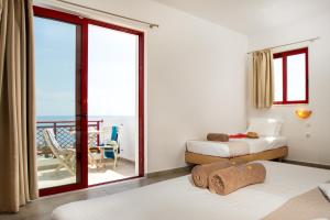 A bed or beds in a room at Bella Vista Stegna