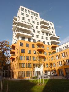 a large apartment building in front of a park at Business Suiten in Munich