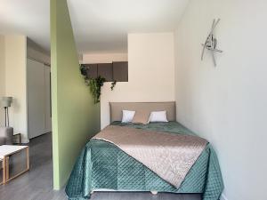 Кровать или кровати в номере Palais Gioffredo