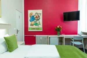 TV a/nebo společenská místnost v ubytování W22 Hotel am Kurfürstendamm