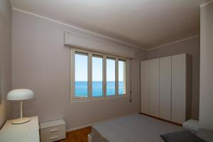Posteľ alebo postele v izbe v ubytovaní Casa Baia Blu
