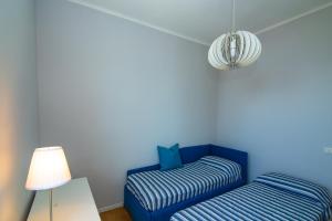 Posteľ alebo postele v izbe v ubytovaní Casa Baia Blu