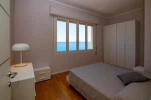 Posteľ alebo postele v izbe v ubytovaní Casa Baia Blu