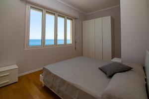 Posteľ alebo postele v izbe v ubytovaní Casa Baia Blu