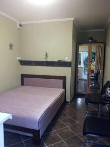 Postel nebo postele na pokoji v ubytování Apartman Ráchegy