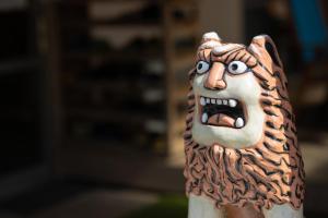 a figurine of a lion with its mouth open at kamekamehouse in Tokashiki