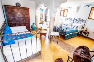 Postel nebo postele na pokoji v ubytování Hotel & Spa Riad Dar El Aila