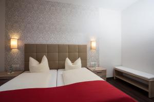 Un pat sau paturi într-o cameră la Hotel Südlohner Hof - Ristorante Da Fabio