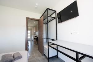 A television and/or entertainment centre at Anemona Beach apartments