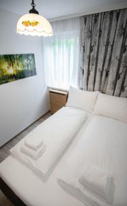 Łóżko lub łóżka w pokoju w obiekcie Apartment Tauernfex Kaprun