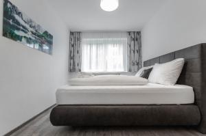 Łóżko lub łóżka w pokoju w obiekcie Apartment Tauernfex Kaprun