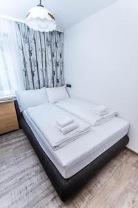 Łóżko lub łóżka w pokoju w obiekcie Apartment Tauernfex Kaprun
