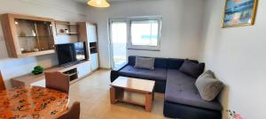 a living room with a couch and a table at Apartment Miroslav in Krk