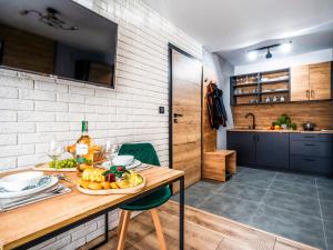 Kuchyňa alebo kuchynka v ubytovaní Apartamenty Tatrzańskie Doliny