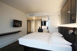 Postel nebo postele na pokoji v ubytování Hotel AMANO Grand Central