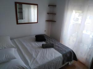 Ένα ή περισσότερα κρεβάτια σε δωμάτιο στο Apartments Ana