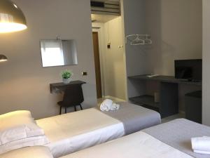 Posteľ alebo postele v izbe v ubytovaní Hp Fly Hotel Bologna
