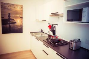 Kuchyňa alebo kuchynka v ubytovaní Residence Neverin Trieste