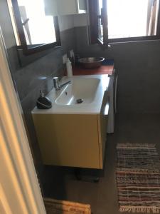 a bathroom with a white sink and a mirror at Airport Malpensa GALLARATE in Gallarate +47 photos