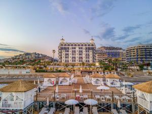 a view of a resort with tables and umbrellas at ARIA RESORT & SPA HOTEL Ultra All Inclusive in Konaklı