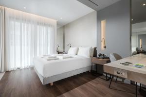 Postel nebo postele na pokoji v ubytování Ivis 4 Boutique Hotel + 37 fotografií