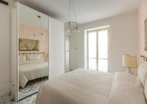 Säng eller sängar i ett rum på Leonardo al Duomo - Bufalini Apartments