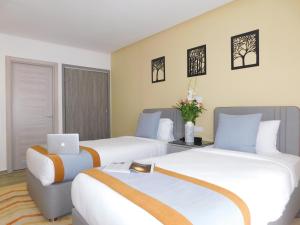 Postel nebo postele na pokoji v ubytování Gardenia Boutique Hotel