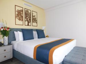 Postel nebo postele na pokoji v ubytování Gardenia Boutique Hotel