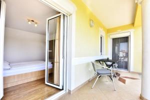 Postel nebo postele na pokoji v ubytování Tomic Apartments