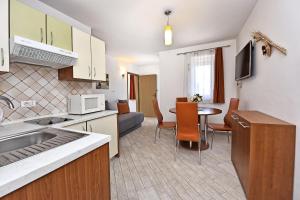Kuchyň nebo kuchyňský kout v ubytování Tomic Apartments