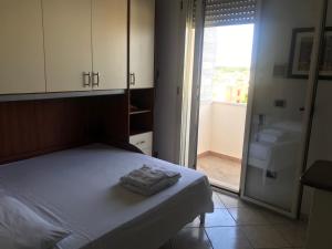 A bed or beds in a room at Residence Massilor