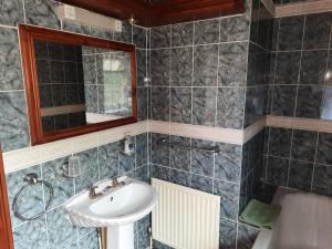 a bathroom with a sink and a mirror at Self Contained apartment in Winterton Hall in Great Yarmouth