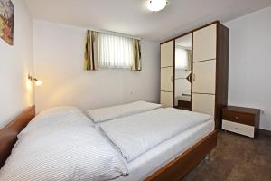 Postel nebo postele na pokoji v ubytování Tomic Apartments