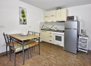 Kuchyň nebo kuchyňský kout v ubytování Tomic Apartments