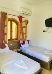 Cama ou camas em um quarto em Villa 22