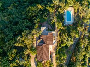 an overhead view of a house in the forest at Villa L'Arbousière in Porto-Vecchio