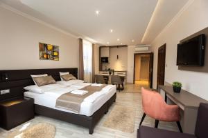 Postel nebo postele na pokoji v ubytování Végvár Spa Apartman