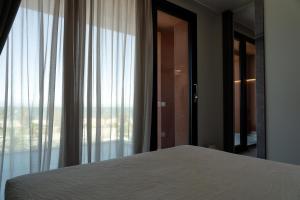 Postel nebo postele na pokoji v ubytování PICCOLA MAESTA' boutique rooms