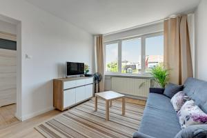 Televízia a/alebo spoločenská miestnosť v ubytovaní Lion Apartments - Korfu