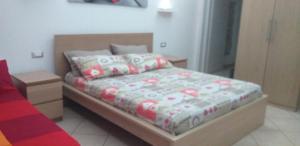 Postel nebo postele na pokoji v ubytování Piccola Azzurra Branch + 1 fotografie